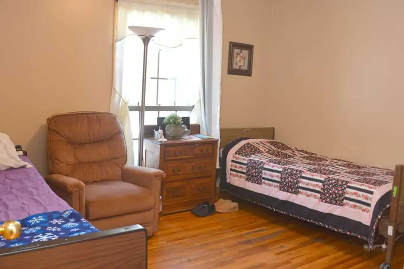 Bedroom with recliner and window