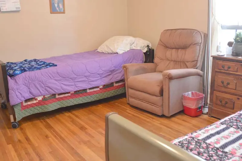 Bedroom with patterned quilt