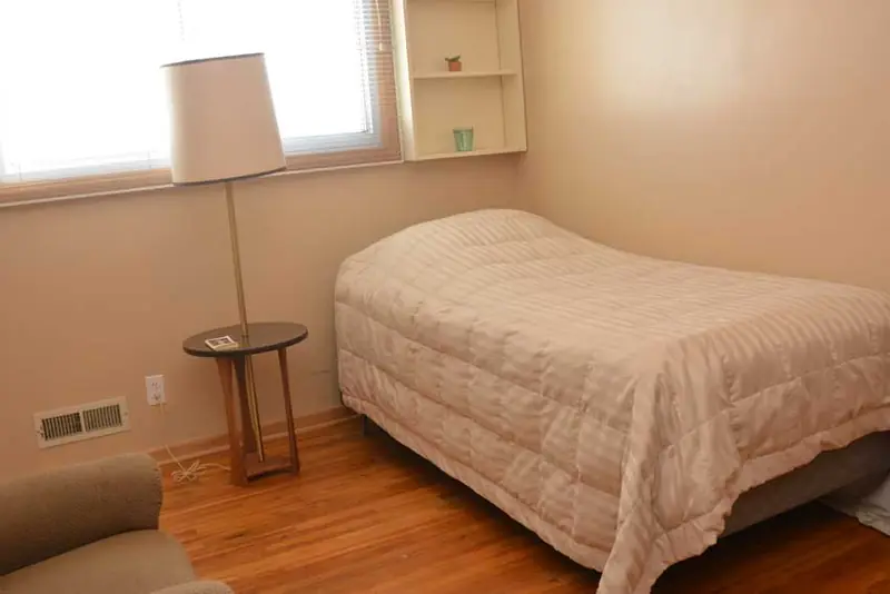 Bright bedroom with large window
