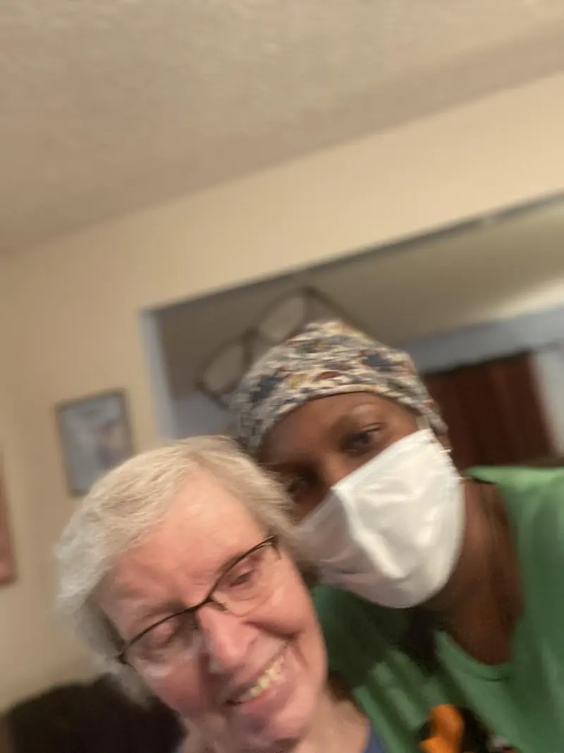 Caregiver and resident taking a selfie
