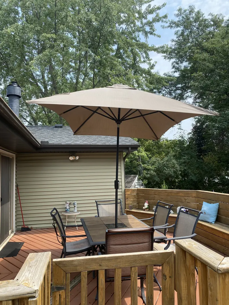 Back deck with umbrella and patio table